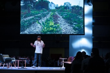 2019 MacArthur Fellow and co-founder of the Sweetwater Foundation, Emmanual Pratt speaking at reSITE 2019 REGENERATE | Photo courtesy of Tomáš Princ