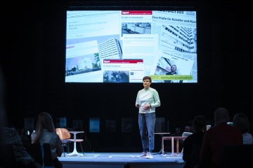 Leona Lynen, project manager for ZUsammenKUNFT presenting their cooperative project, Haus der Statstik, at reSITE | Photo courtesy of Tomáš Princ